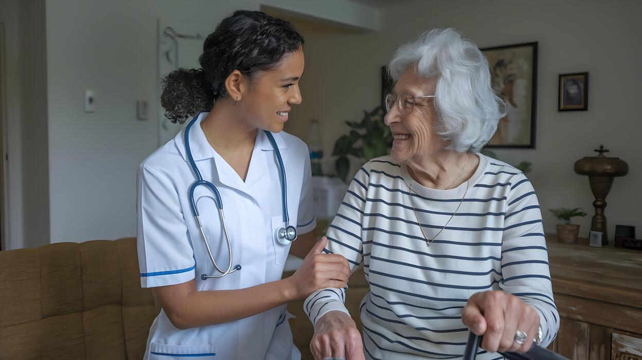 a-nurse-helping-an-elderly-woman-with-a-walker-free-photo